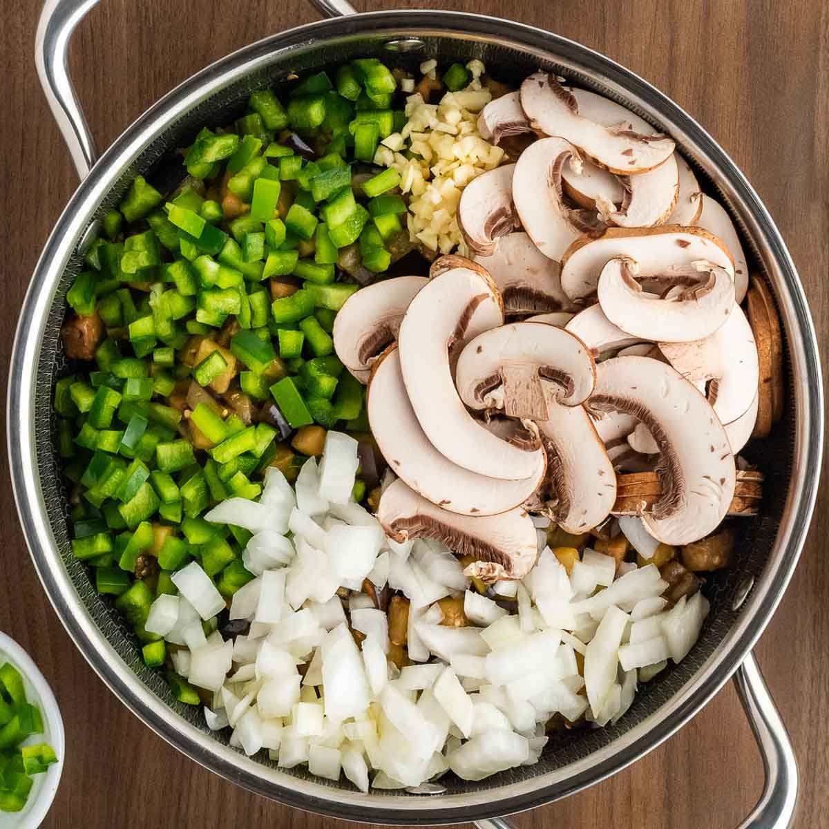 Mushrooms and other ingredients added to the pan.