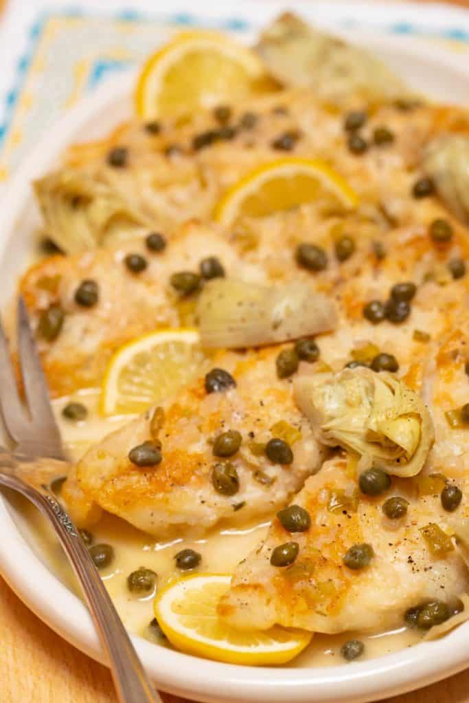 white platter filled with Easy Fish Piccata with Artichokes