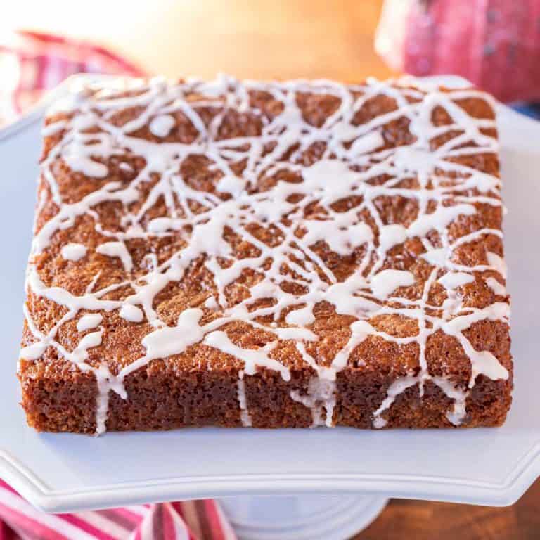 Light blue cake stand holding a Sticky Ginger Cake