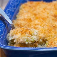 spoonful of Twice Baked Potato Casserole over the dish, showing its texture