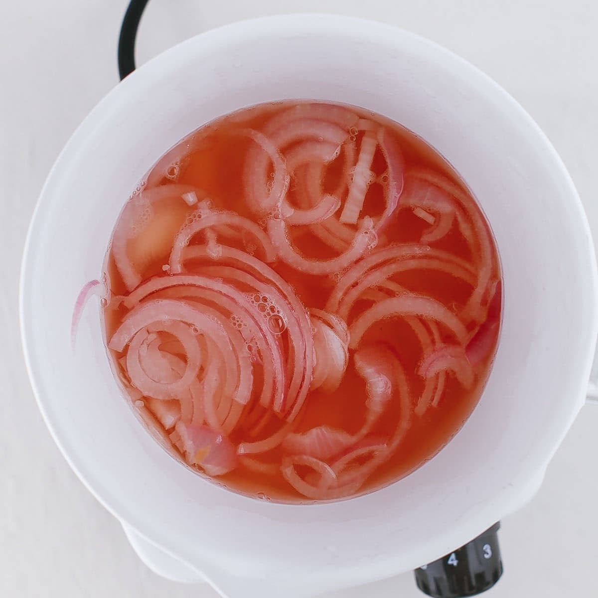 Pickled onions in a bowl.