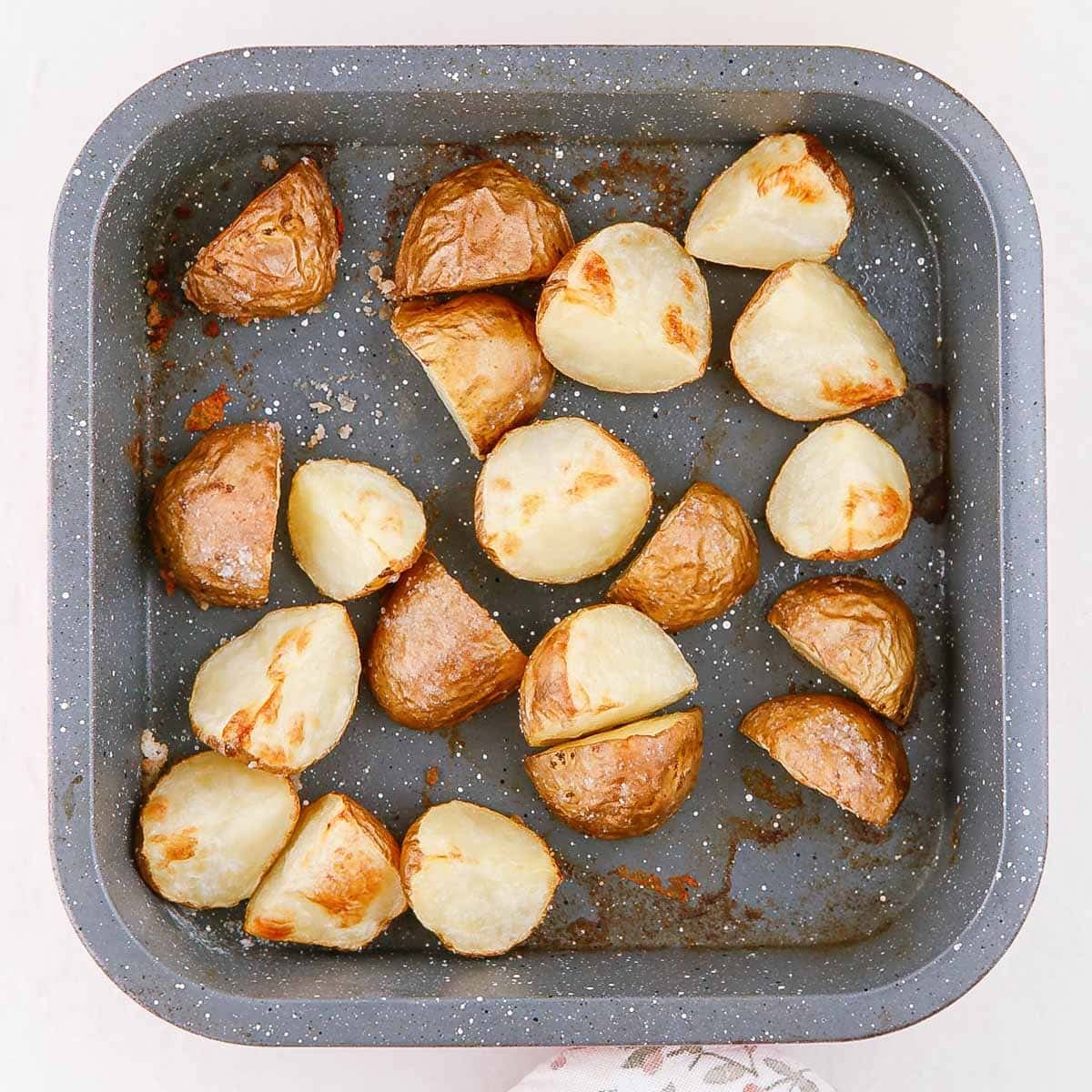 Roasted potatoes in a baking dish.