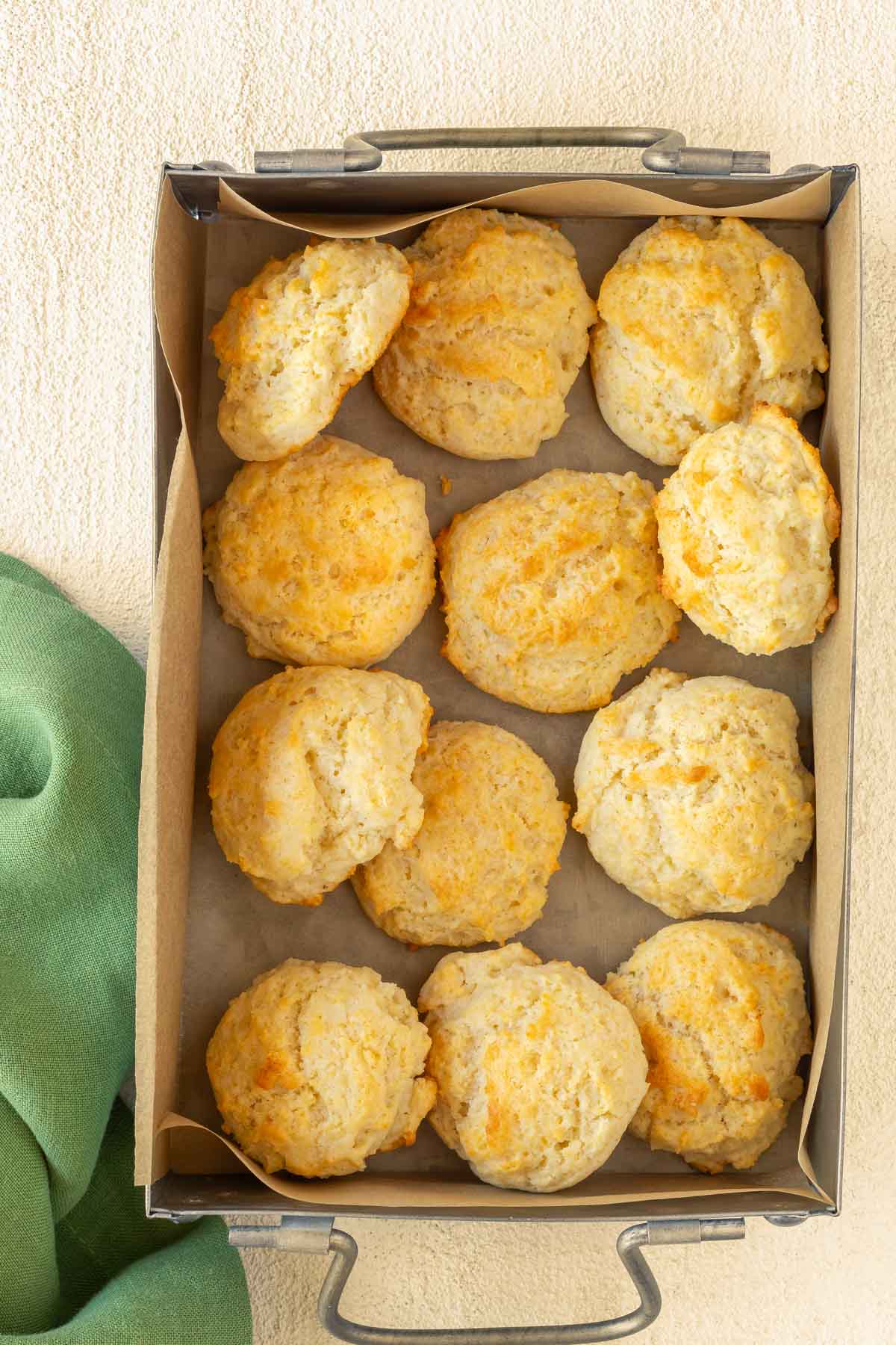 Overhead view of a tin box filled with Drop Biscuits