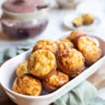 White ceramiv bowl filled with Italian Popovers