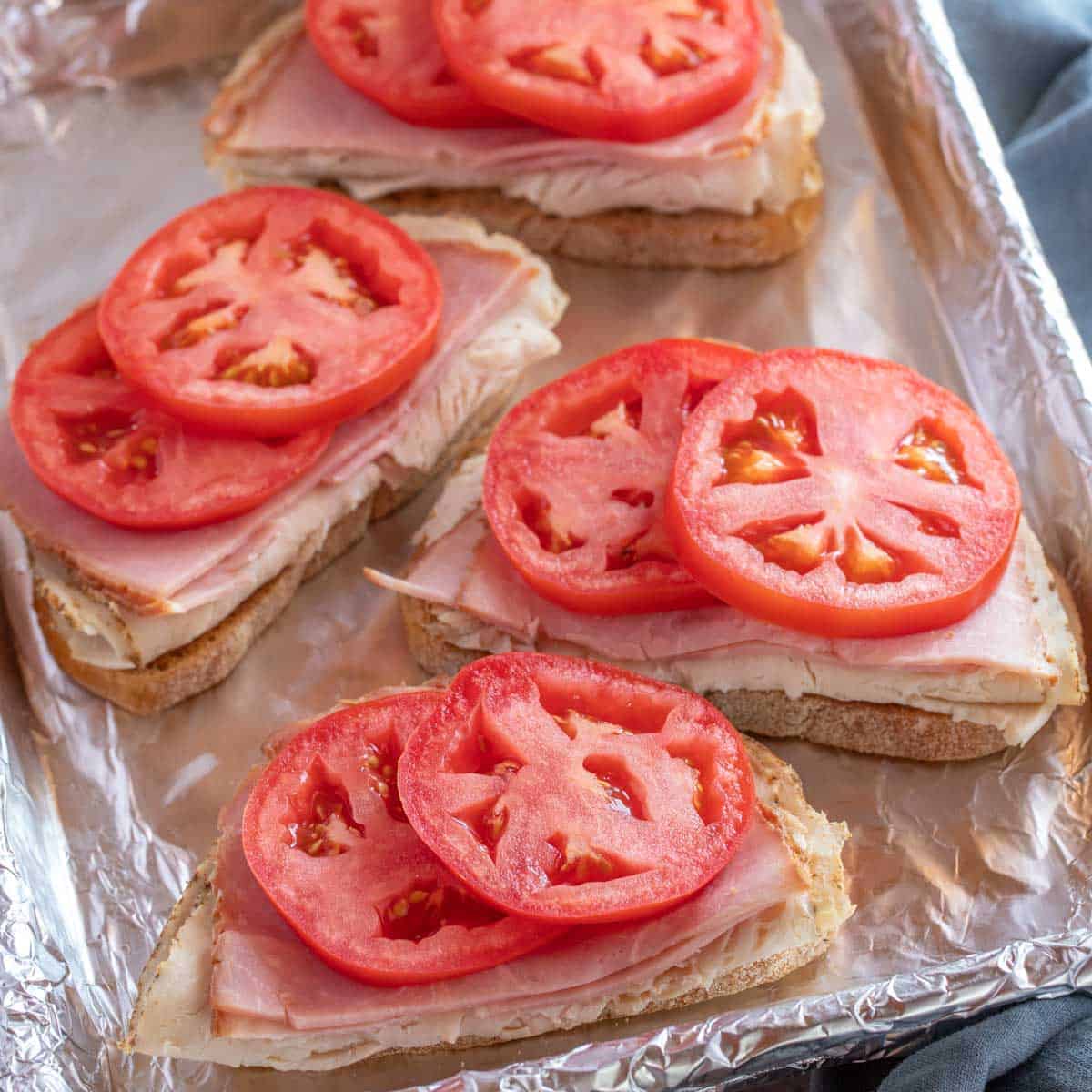 foil lined baking sheet pan with Kentucky Hot Browns, no cheese sauce