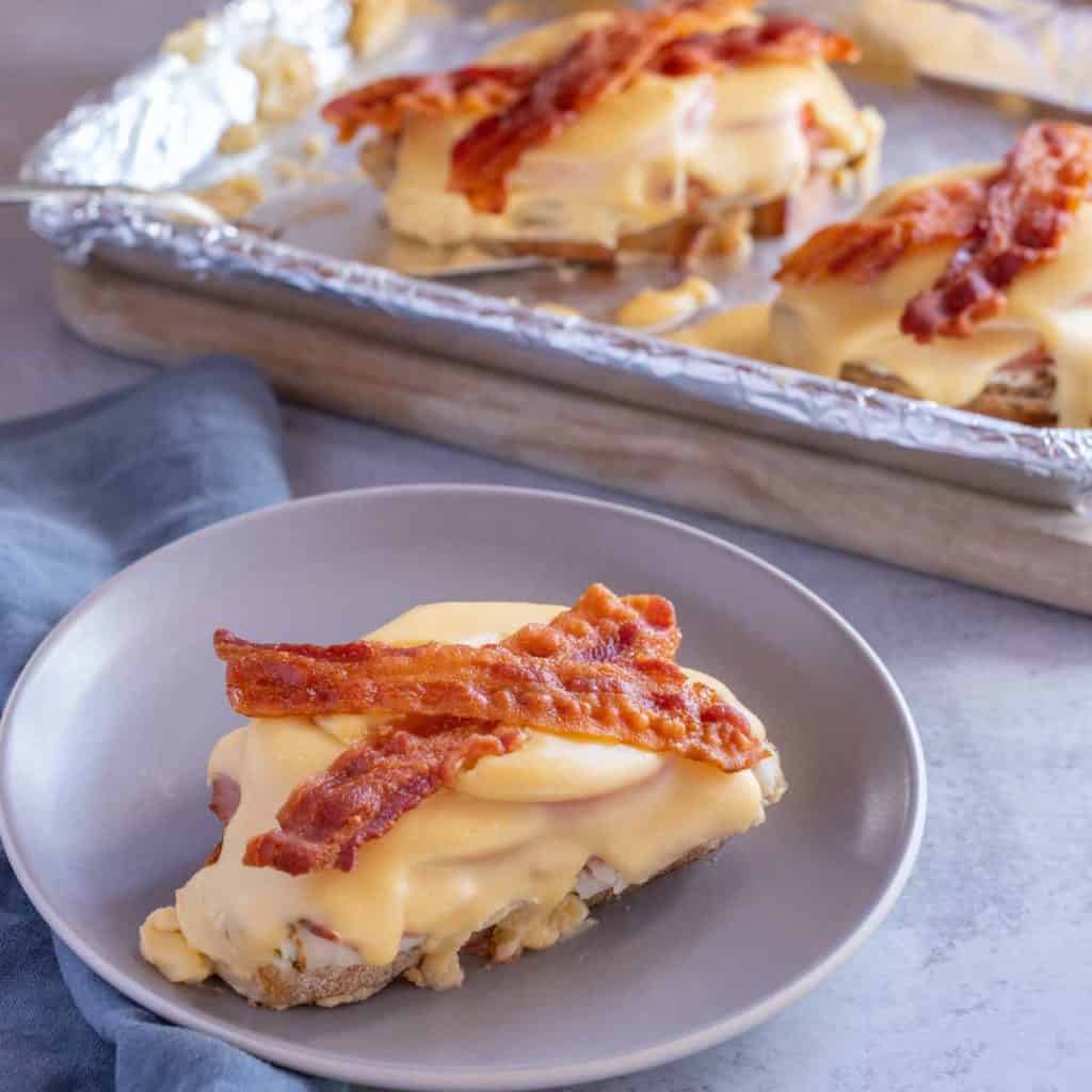 Foil lined, rimmed baking sheet holding Kentucky Hot Browns