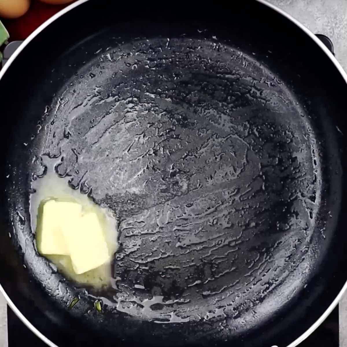 Butter melting in a skillet.