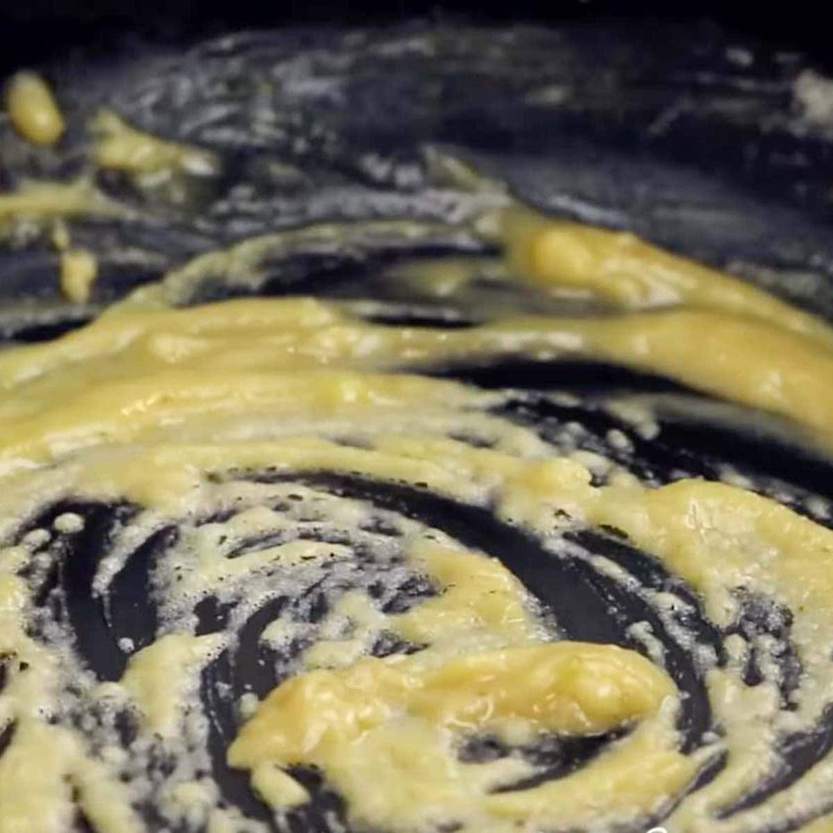 Cooking the roux in a skillet.