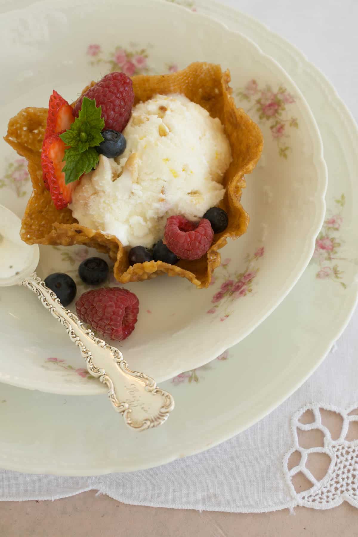Pecan Cookie Cup with a scoop of Lemon Almond Ice Cream with berries