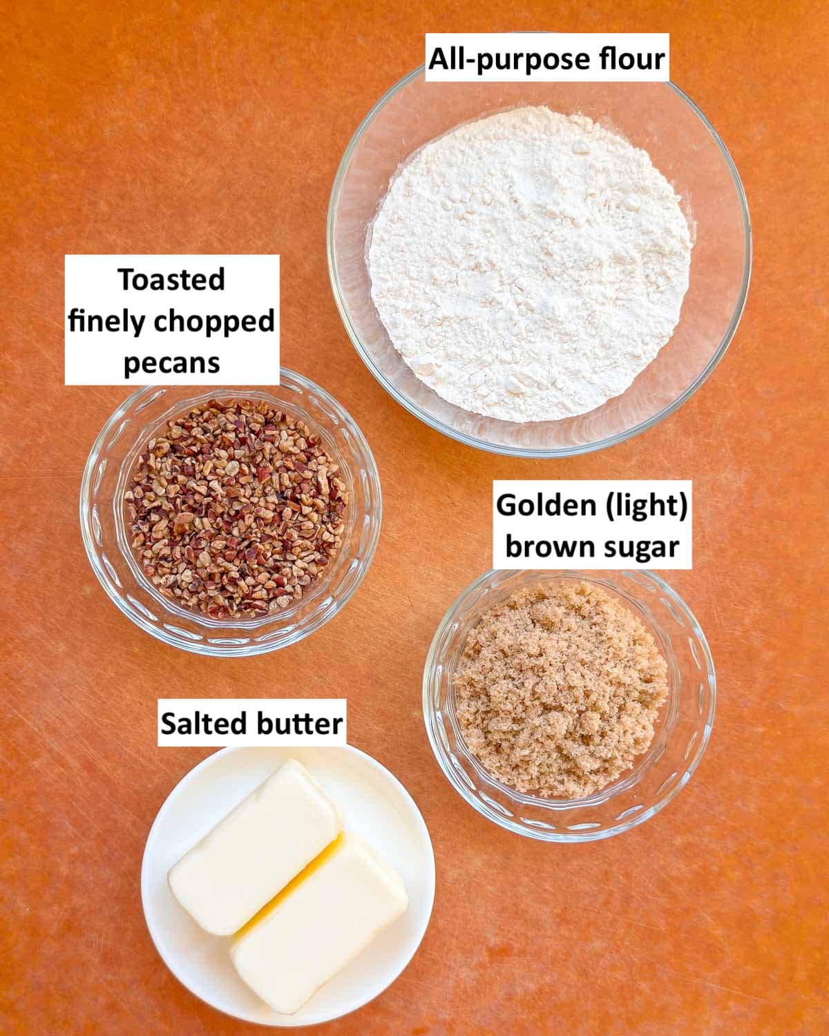 Prepped and ready-to-use ingredients needed to make the buttery pecan crust and top for Lemon Cheesecake Bar cookies.