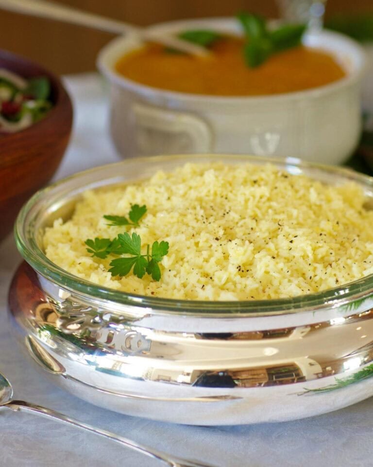 silver serving dish holding Lemon rice