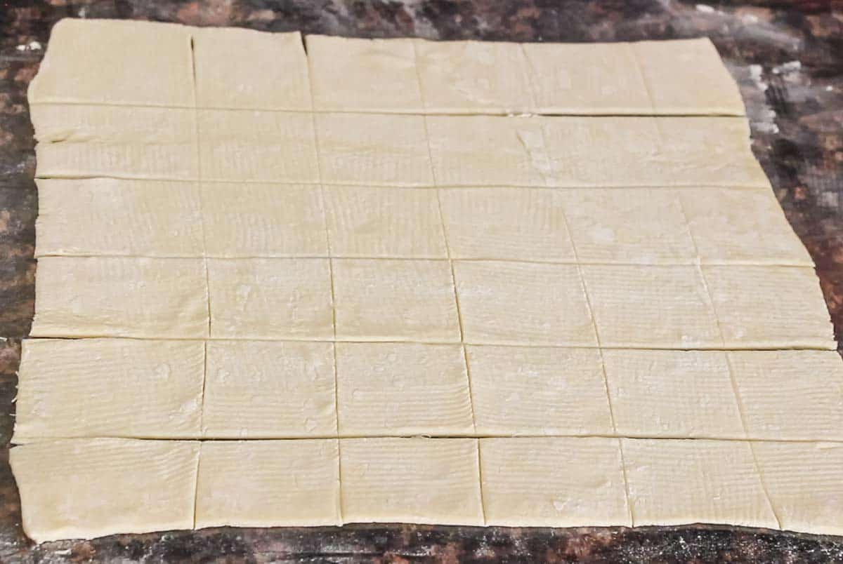 shot of puff pastry rolled and cut for tarts