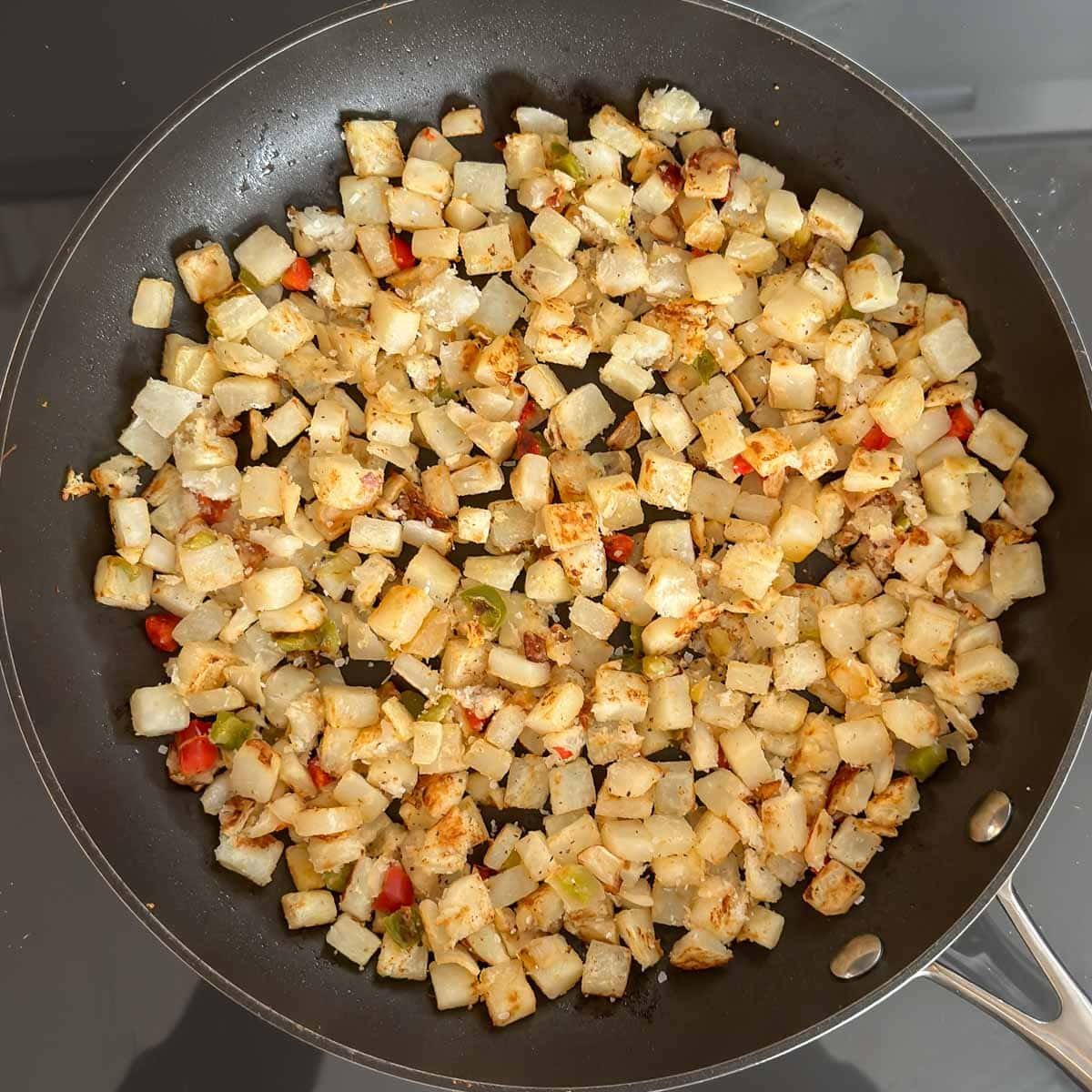 Lightly browned Potatoes O'Brien in a large skillet.