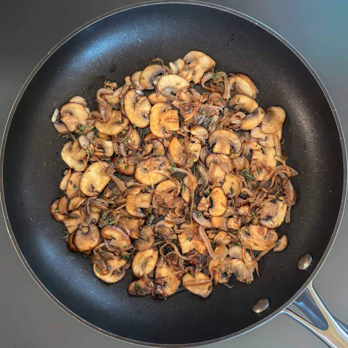 Balsamic vinegar and thyme are to sautéed mushrooms and onions.
