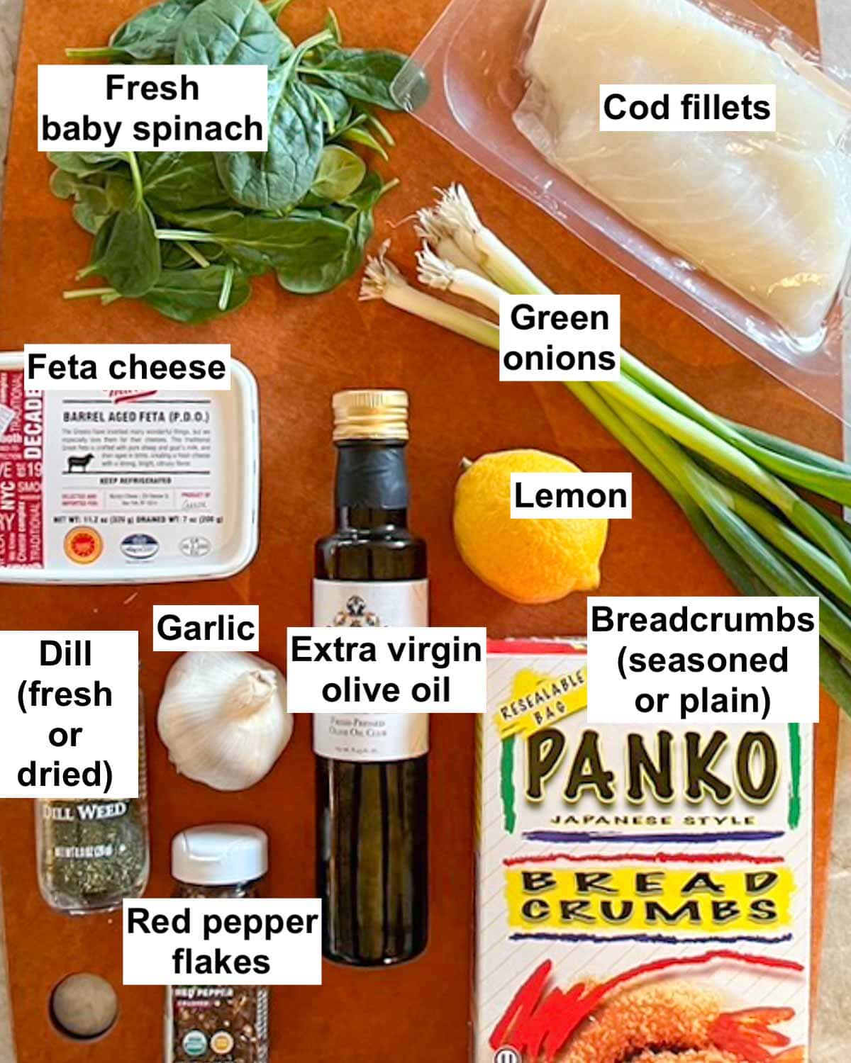 all ingredients needed for this Baked Cod recipe arranged on a cutting board and labeled