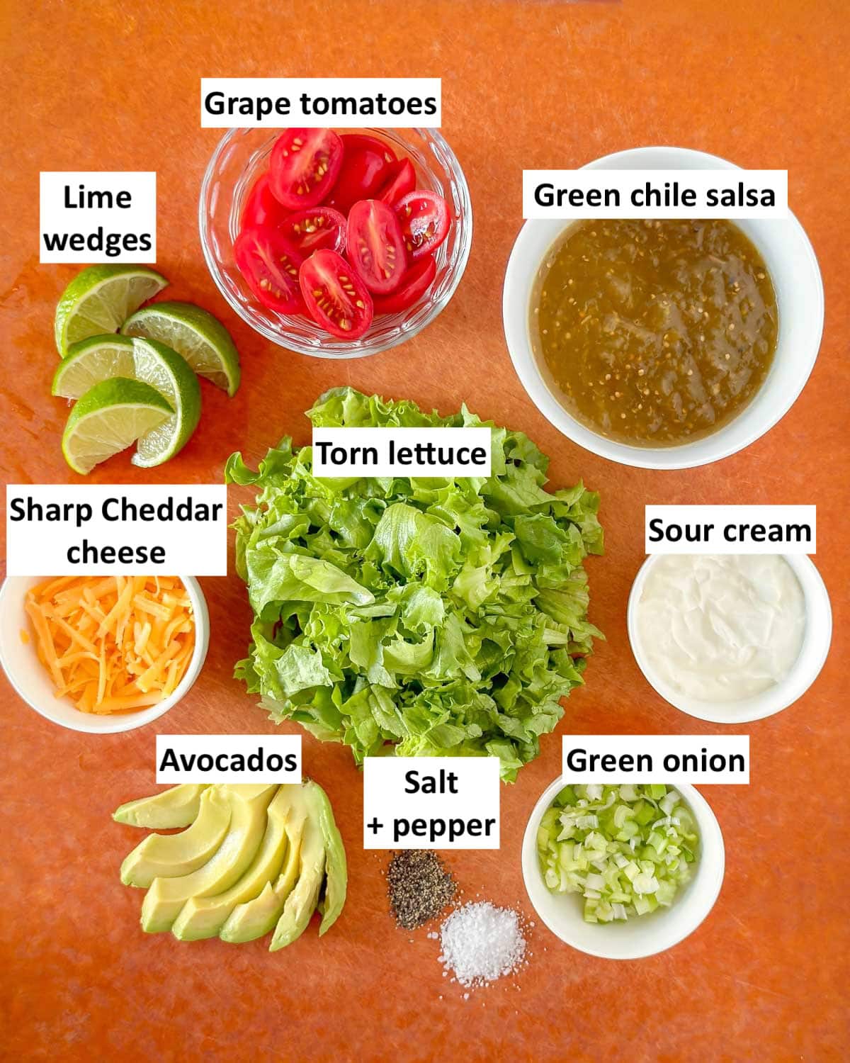 Ingredients for serving baked panko chicken in bowls on a countertop and labeled with ingredient name.