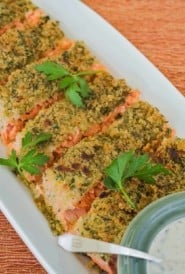 overhead showing slices of Parmesan Crusted Salmon with bowl of Herb Mayo