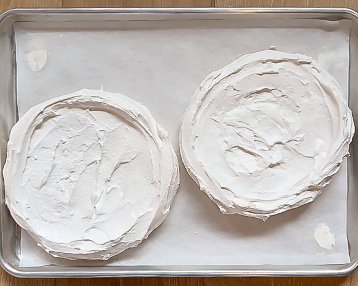 Overhead view showing 2 Pavlova meringue bases with no filling