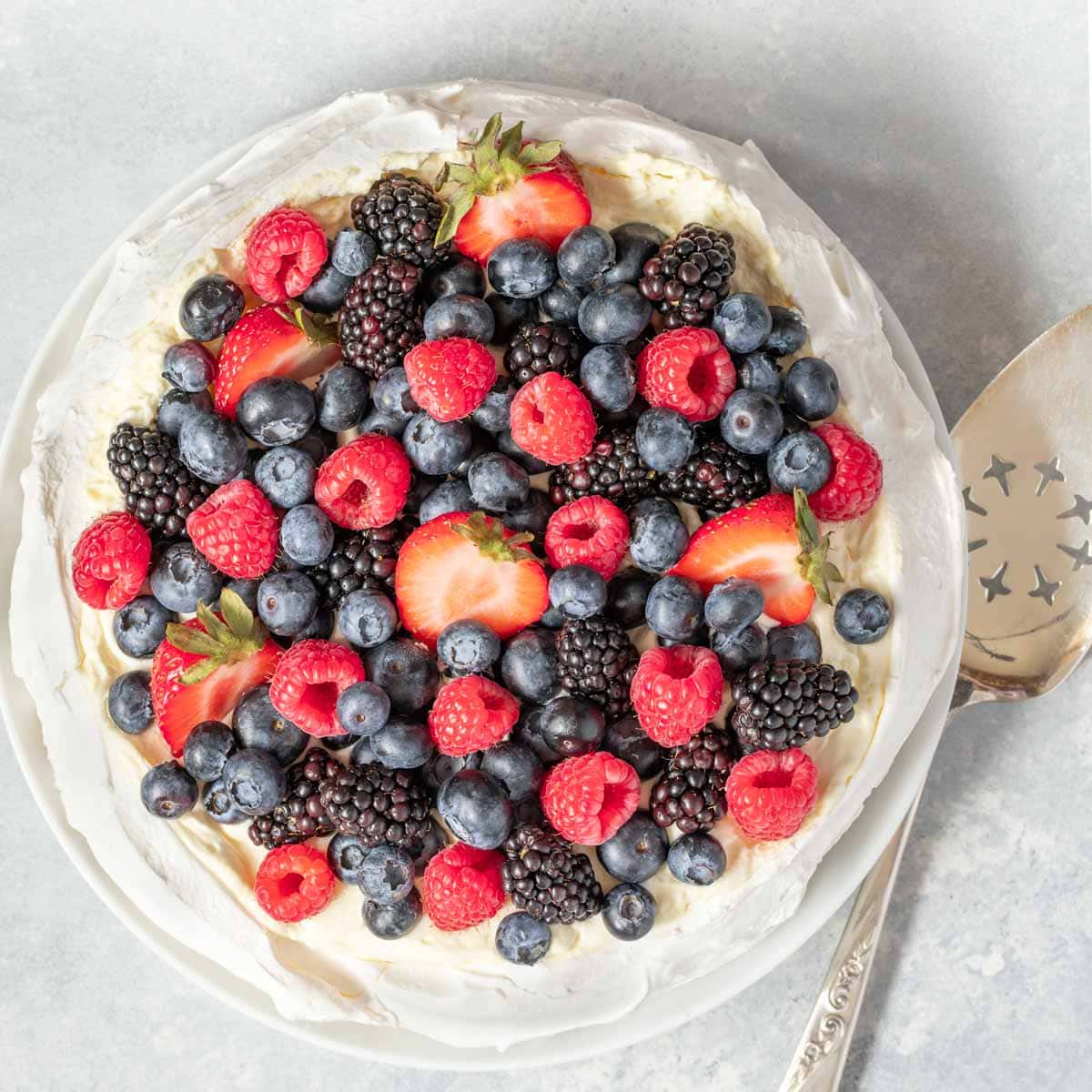 Overhead of Pavlova topped with fresh berries