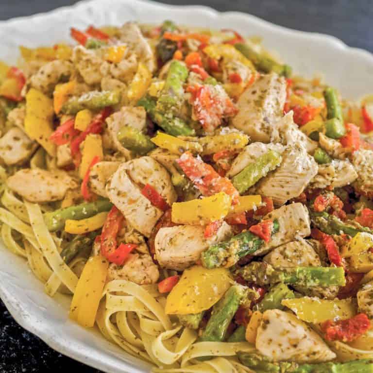 white platter showing Pesto Chicken and Vegetables with Pasta