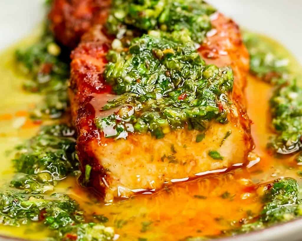 shot of a Spicy Pork Chop with Chimichurri with the end cut off, showing the inside