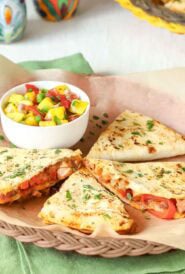 wicker plate holding one serving of leftover pork quesadillas.