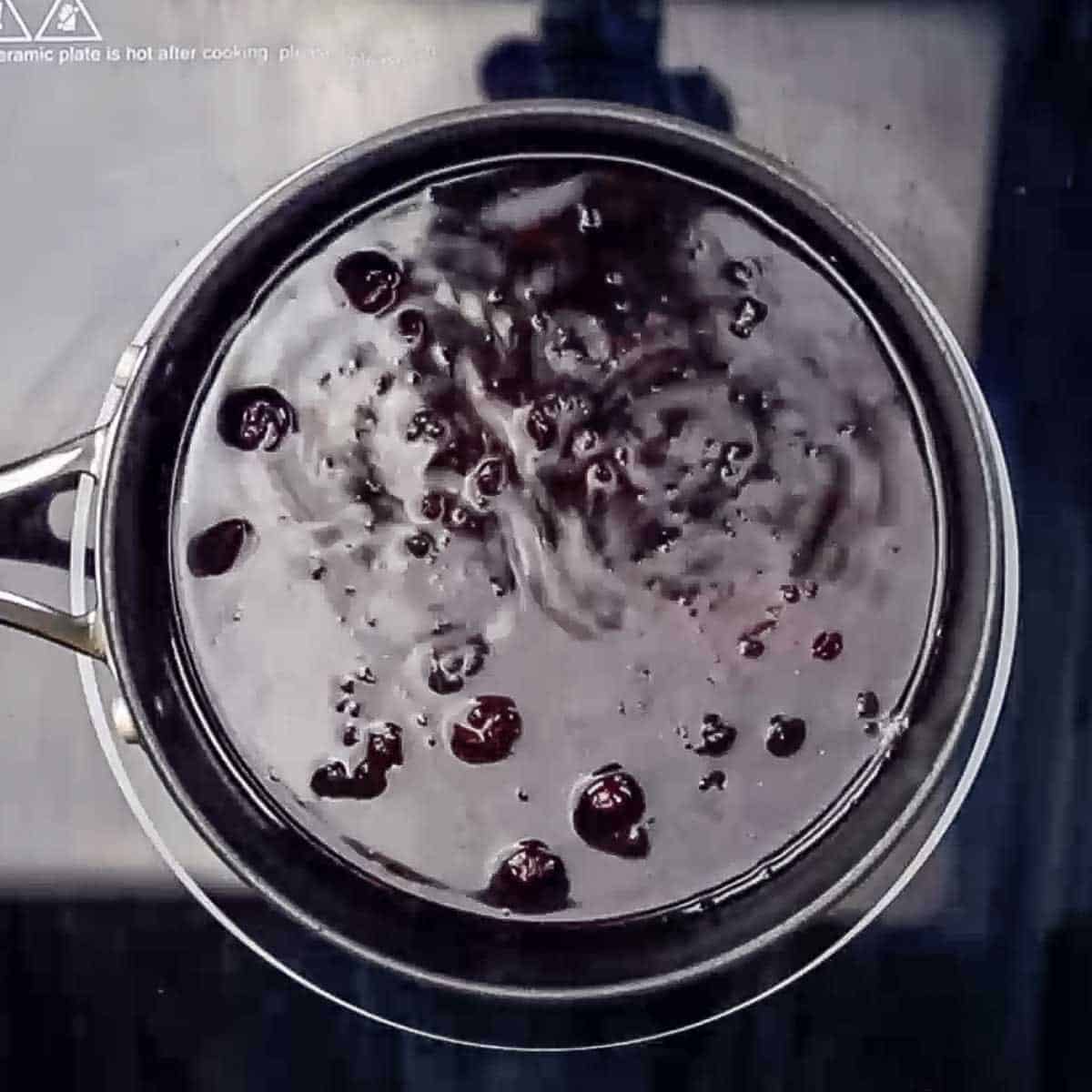 Overhead view of cranberry sauce cooking