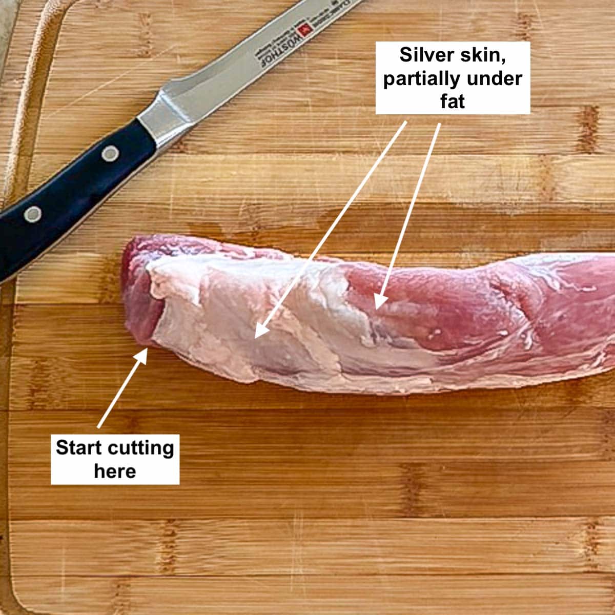 overhead shot of a raw pork tenderloin showing what the silver skin looks like