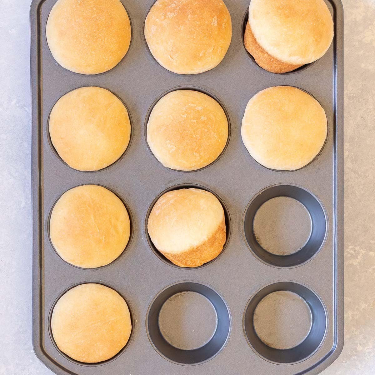 muffin tin holding 9 quick dinner rolls