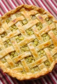 Rhubarb Pie on top of a red striped dish towel.