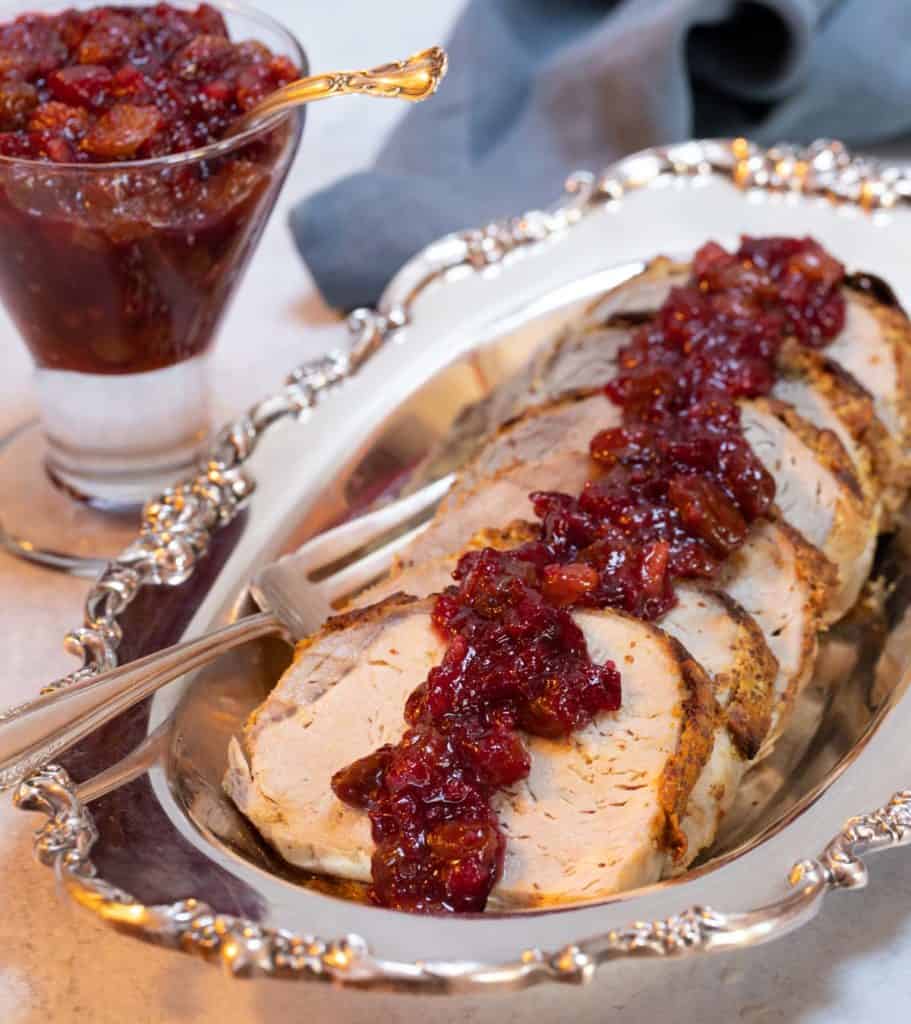 silver platter with Roasted Pork Loin with Fruit Conserves