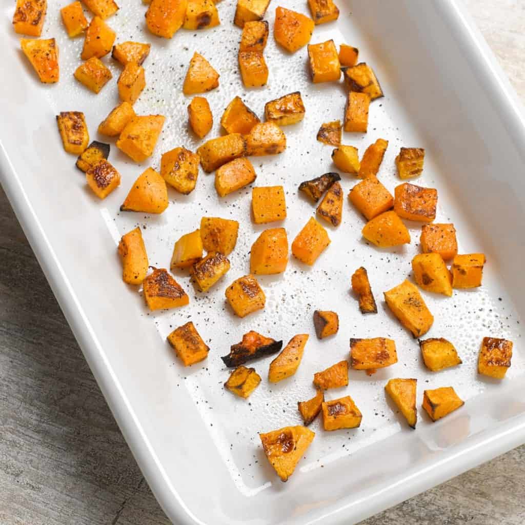 overhead shot of roasted butternut squash showing how to spread it out in the pan