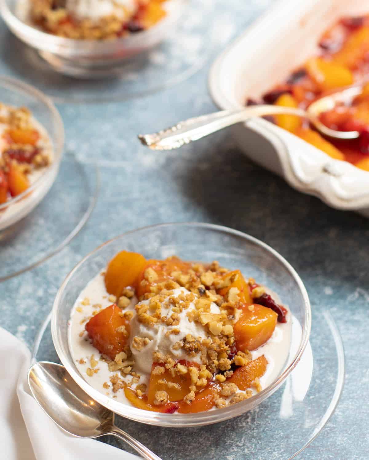 Roasted peaches, nectarines and plums over ice cream with candied walnuts
