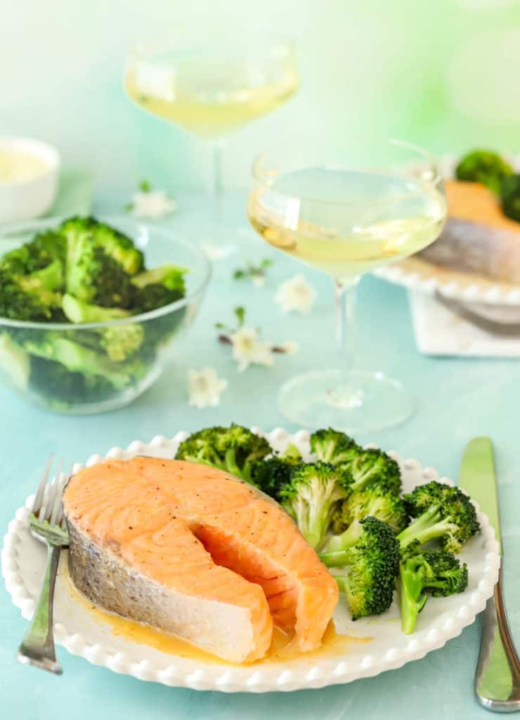 plate holding one Roasted Salmon Steak, with broccoli on the side