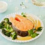 plate holding one Roasted Salmon Steak, with broccoli on the side