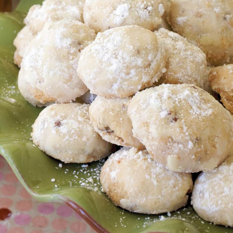 green ruffled plate filled with Grandma Clayton's Sand Tarts