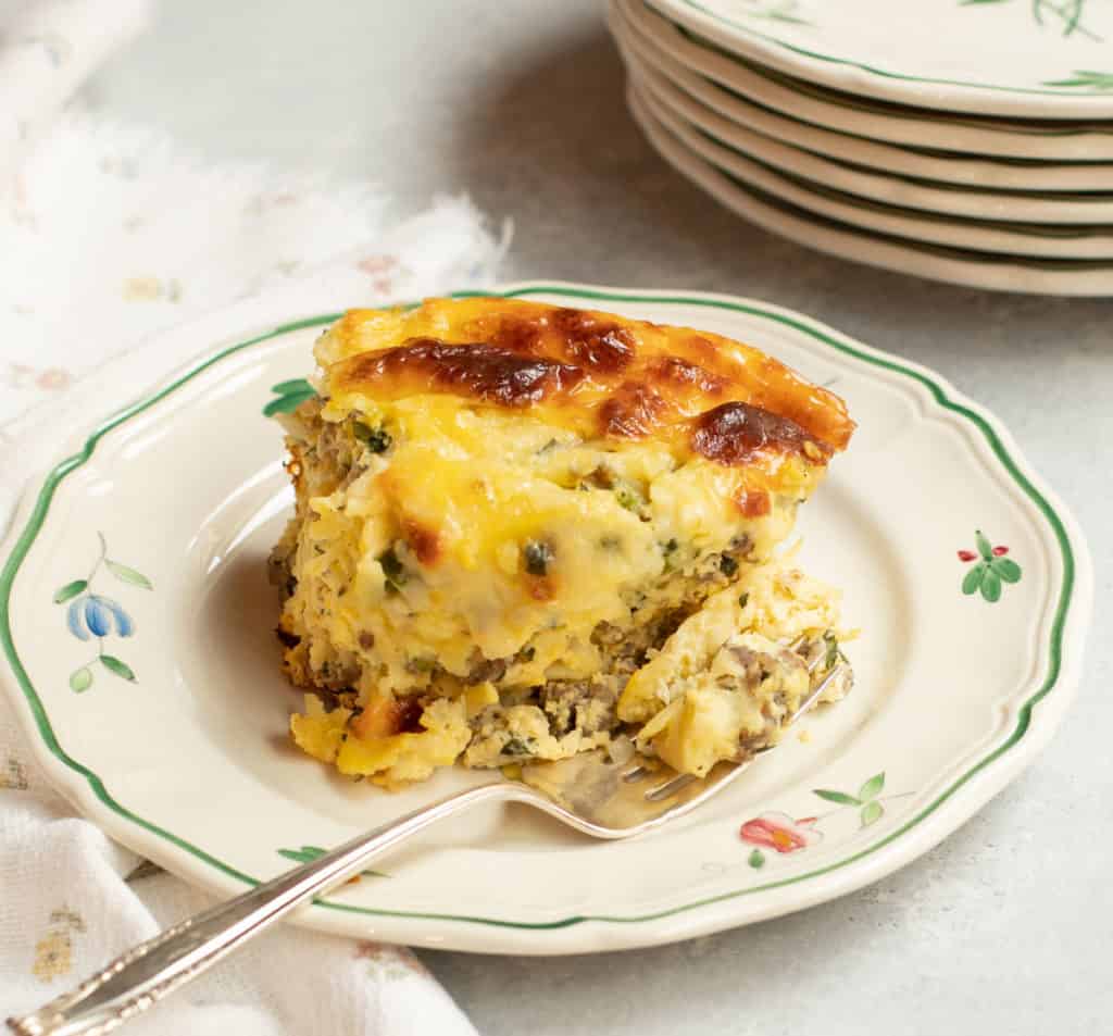 Single slice of Sausage, Cheese and Hash Brown Strata on a plate