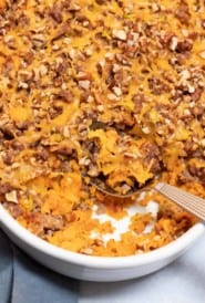 Sausage, Butternut Squash and Yam Casserole in a white baking dish