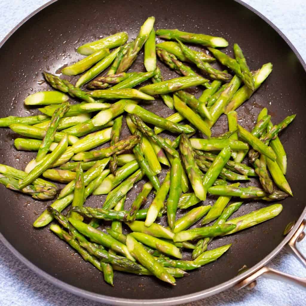 Large skillet filled with Quick and Easy Sauteed Asparagus