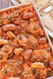 Sheet pan with chicken, carrots and potatoes with a mushroom sauce