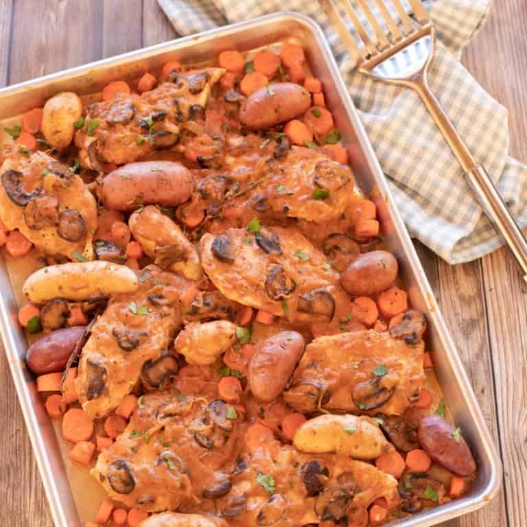 Sheet pan with chicken, carrots and potatoes with a mushroom sauce