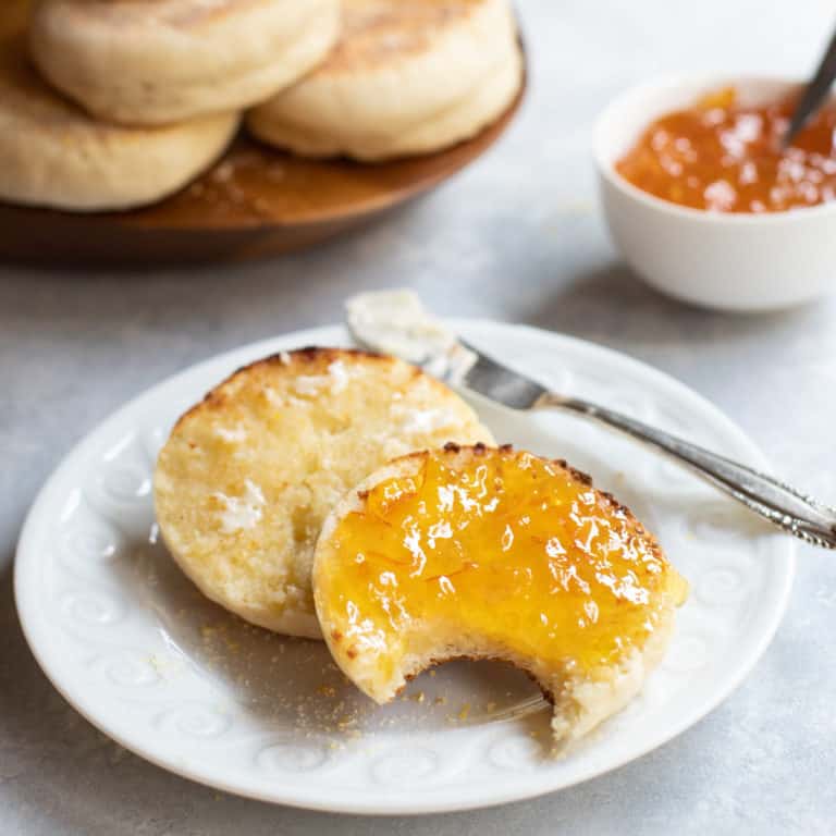 Sliced toasted english muffin with orange marmalade