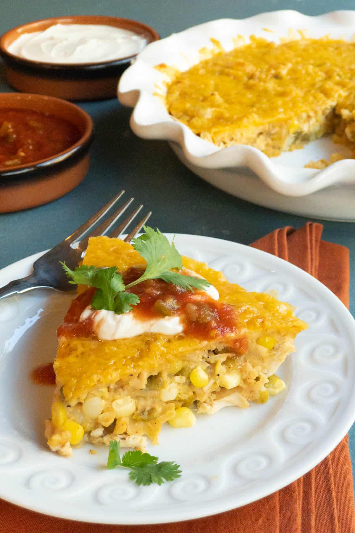 white plate with a slice of Crustless Southwestern Chicken Pie