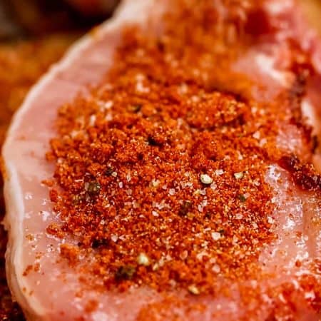 close up of pork chop topped with Spicy Pork Rub