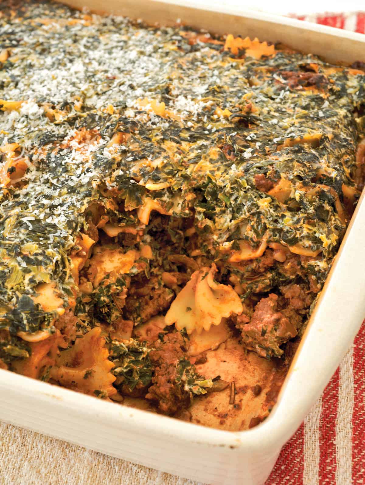 White baking dish with Spinach Farfalle Bolognese