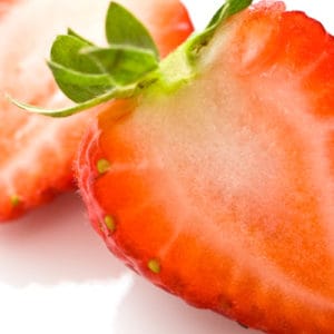 Close-up of a strawberry sliced in half.