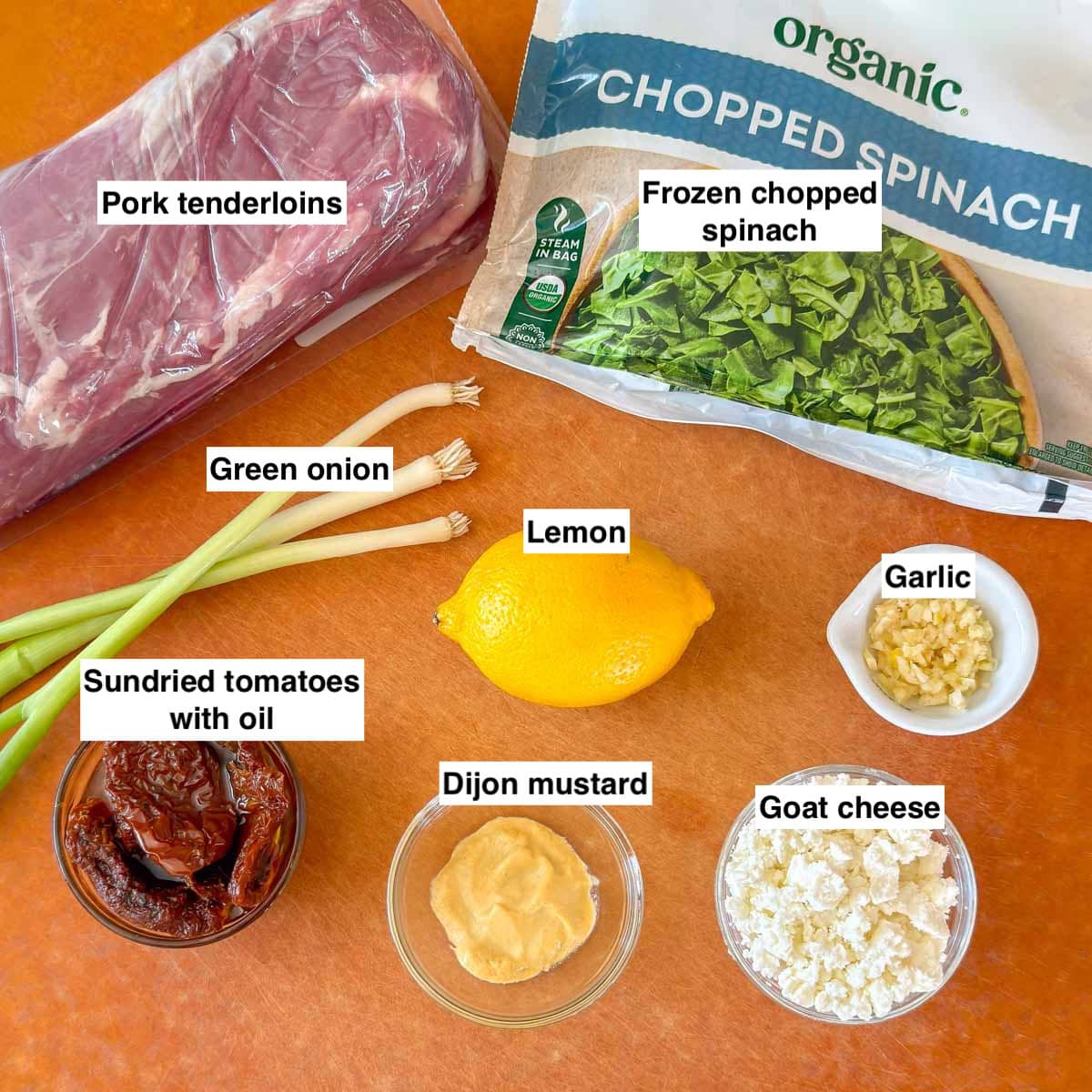 board holding all 8 ingredients in Easy Pork Stuff Tenderloin.
