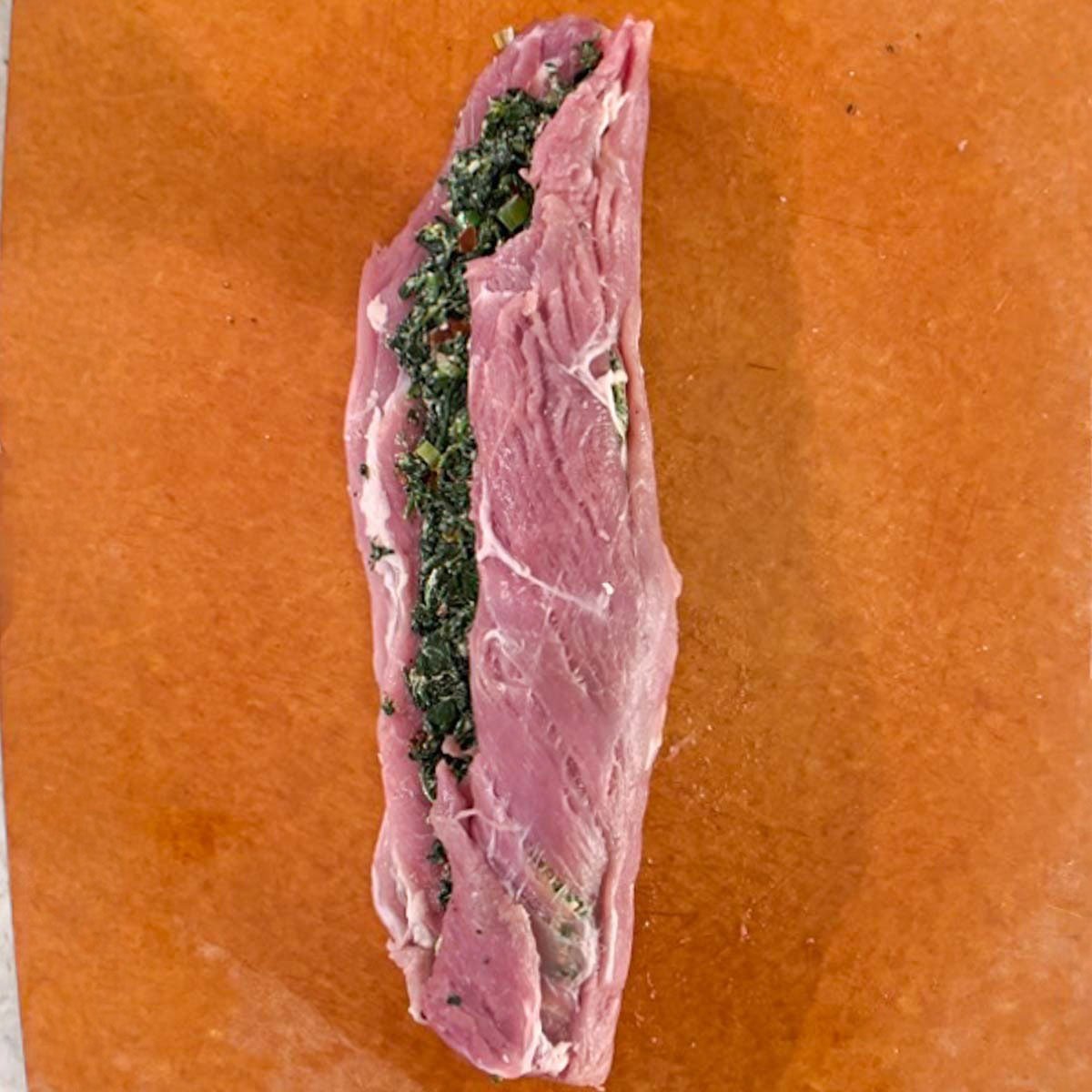 Rolled but not tied stuffed pork tenderloin.