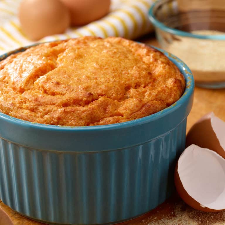 Blue souffle dish filled with Brandied Sweet Potato Souffle