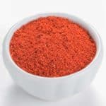 close up of white bowl filled with Taco Seasoning, showing vibrant color.